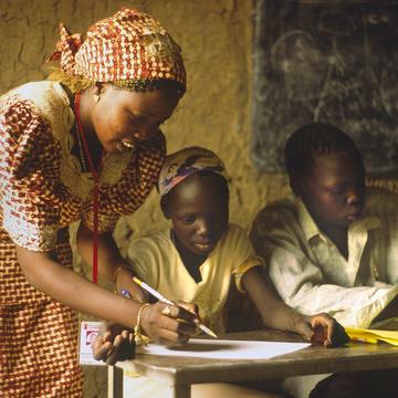 Angelina at school at Myo Msere School at Myo IDP camp with her Nyanjur, a Save the Children teacher Angelina at school at Myo Msere School at Myo IDP camp with her Nyanjur, a Save the Children teacher