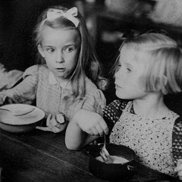 Save the Children USA began with a hot lunch program for undernourished schoolchildren in Harlan County, Kentucky in rural Appalachia. The result was an almost immediate rise in attendance and academic achievement. Photo Credit Save the Children Archive 1932. Save the Children USA began with a hot lunch program for undernourished schoolchildren in Harlan County, Kentucky in rural Appalachia. The result was an almost immediate rise in attendance and academic achievement. Photo Credit Save the Children Archive 1932.