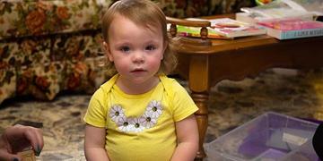 An 18-month old girl stares at the camera during an Early Steps home visit in Kentucky An 18-month old girl stares at the camera during an Early Steps home visit in Kentucky